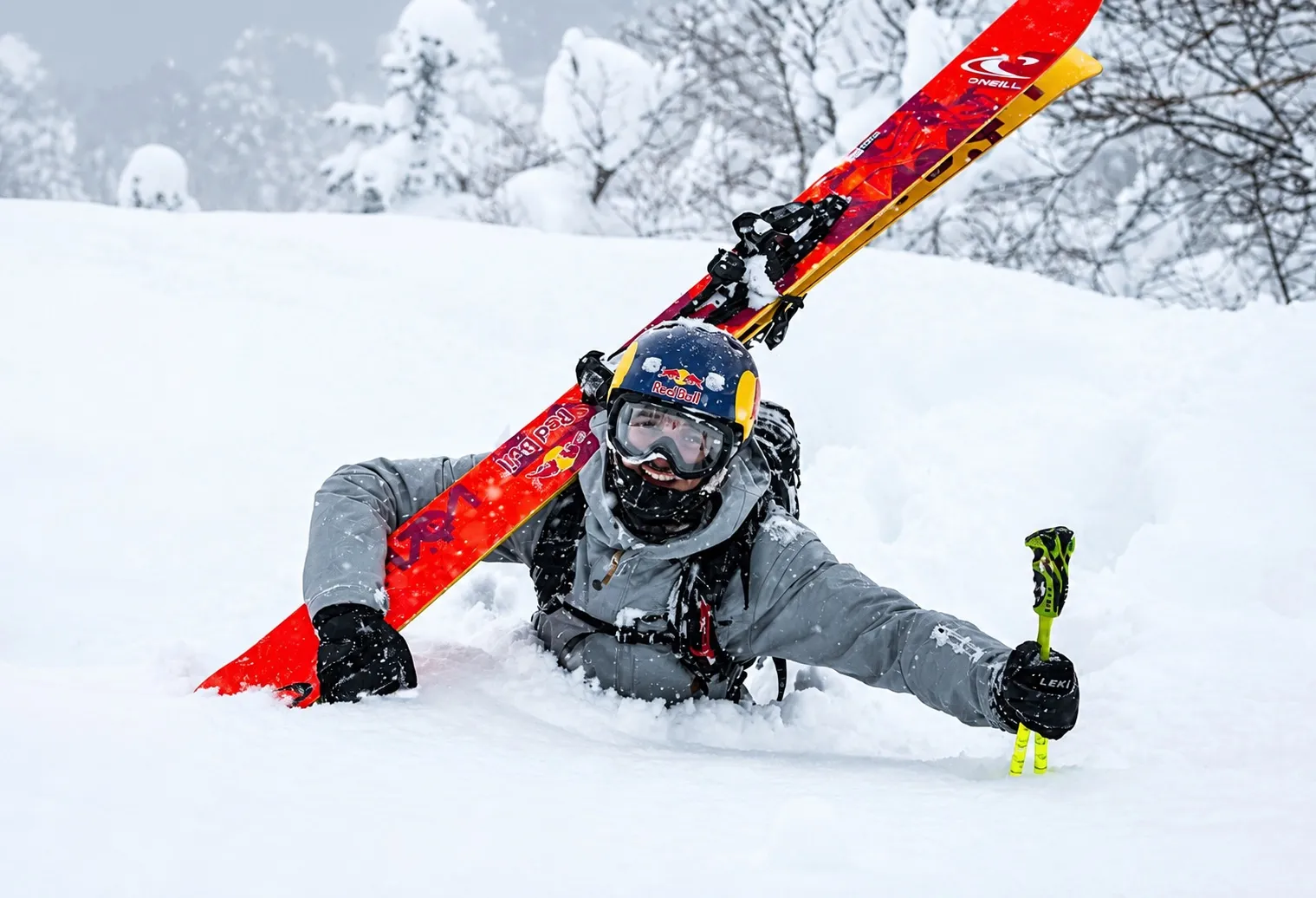 Skier resting in deep snow